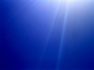 Sun rays in blue sky